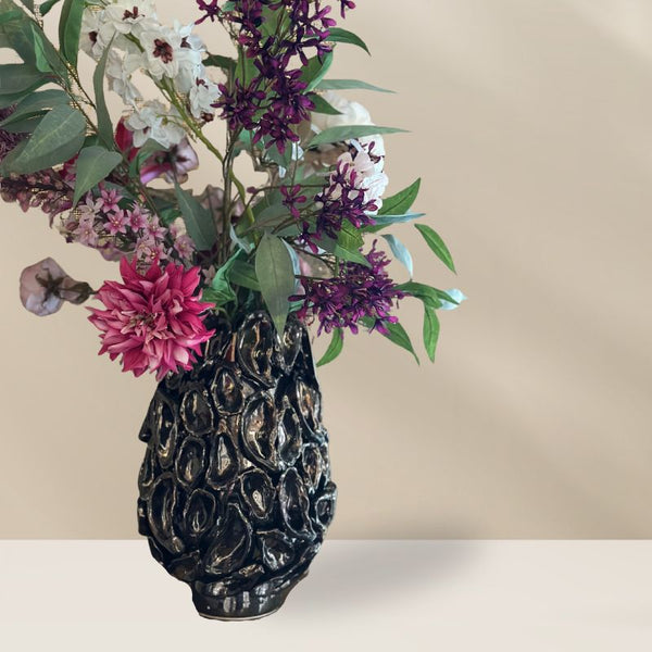 Elegant zijdenbloemenboeket van Jacomijn in zachte pastelkleuren, perfect voor een langdurige decoratie.